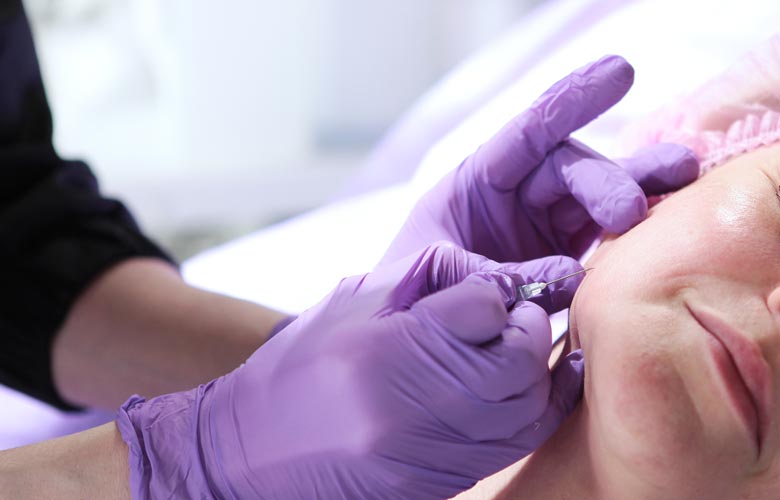 woman receiving facial treatment