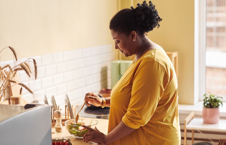 woman making salad