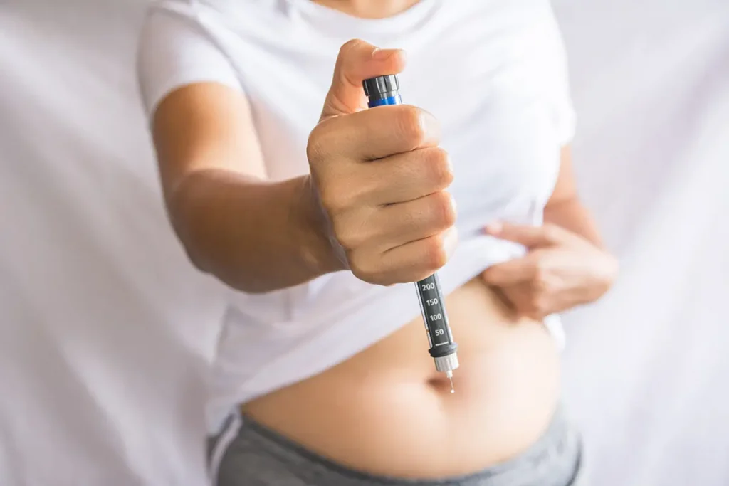 person holding injection needle